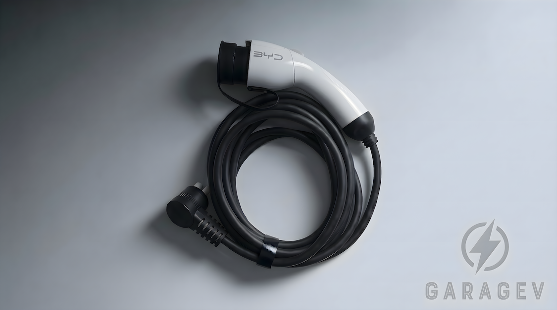 BYD charging cable coiled on a surface with GarageV branding